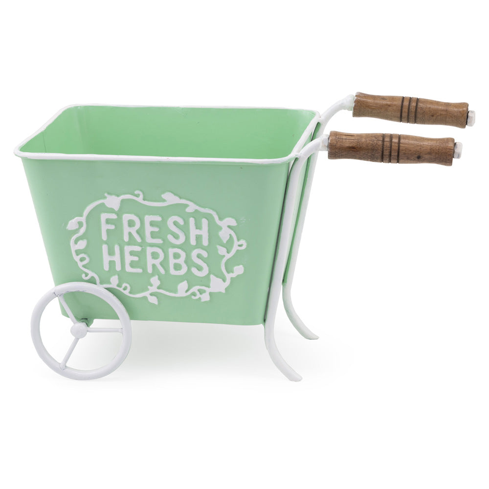 Macetero de hierbas frescas en carrito verde menta
